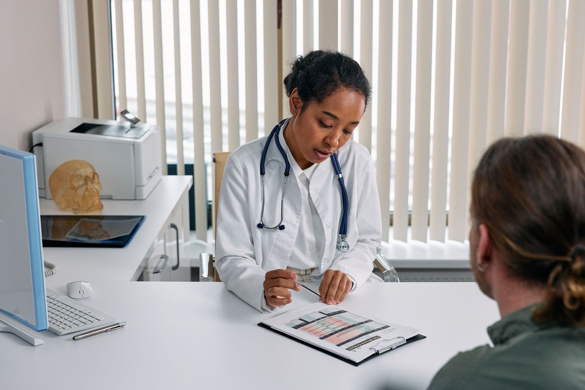 Adult woman in a GP consultation discussing adult ADHD diagnosis UK NHS pathway