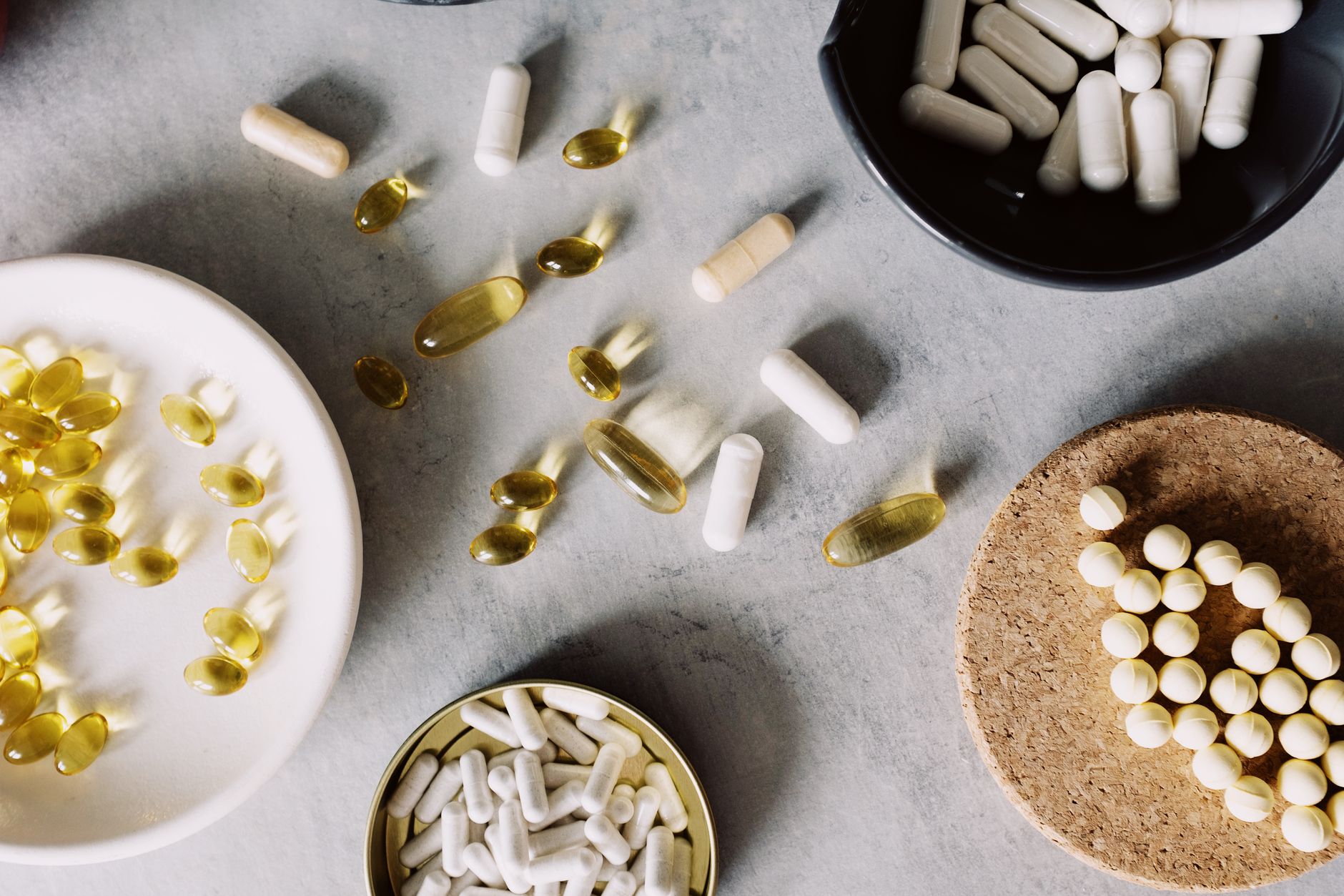 Supplement capsules on a wooden table illustrating the growing discussion around magnesium deficiency UK