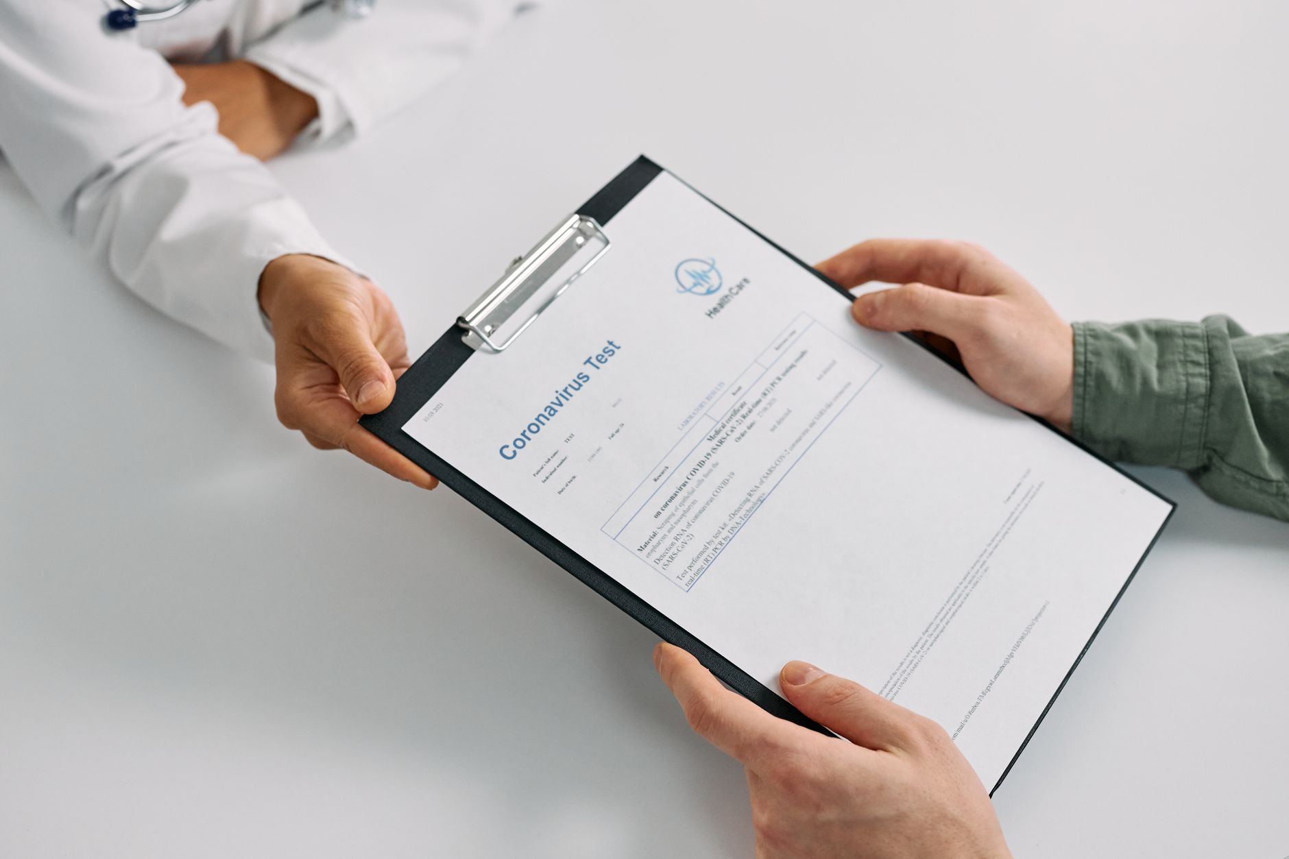 Doctor reviewing blood test results with a patient, relevant to insulin resistance UK screening