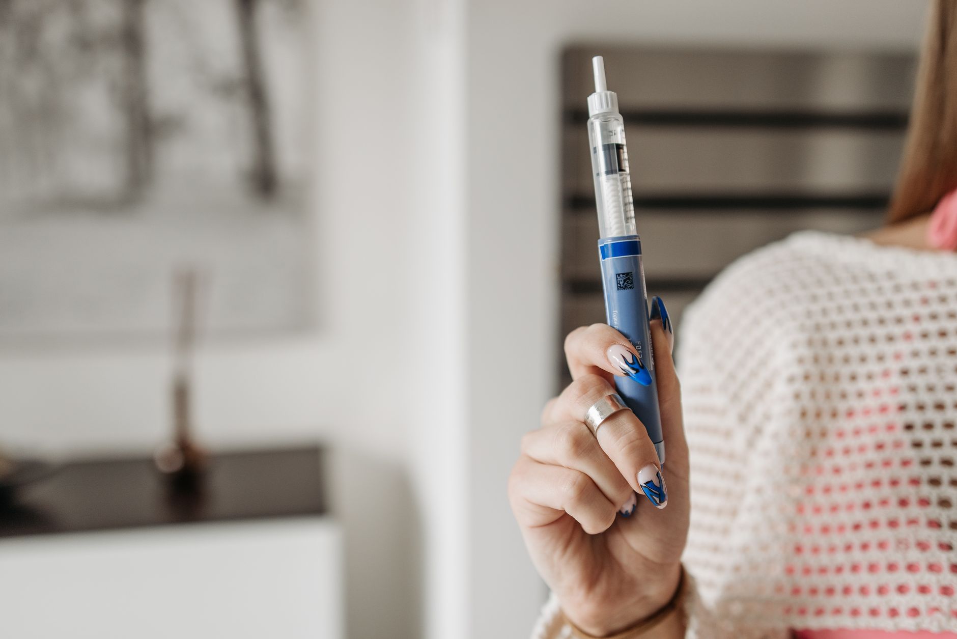 Weekly injection pen used for NHS weight loss injections UK on a clinical white surface