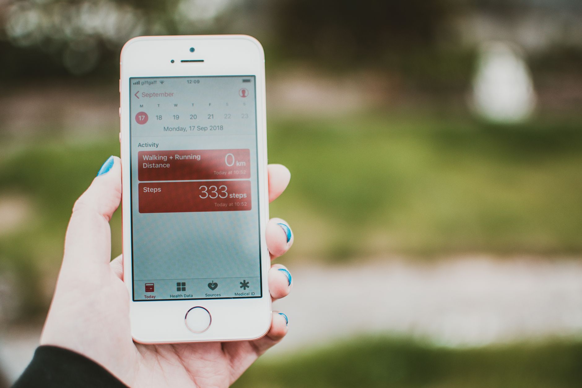 Woman reviewing health app data privacy settings on her smartphone
